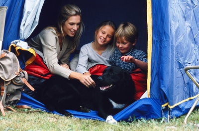 Family camping with dog